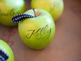 green apples with calligraphy instead of escort cards and with a loop for comfortable carrying