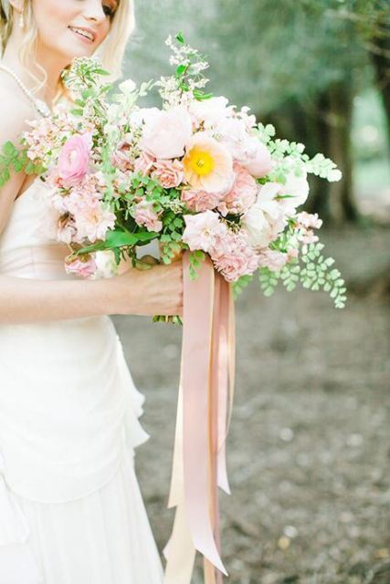 a pink and white wedding bouquet with greenery and pink silk ribbon is a lovely idea for a spring or summer wedding