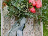 a bold and bright bouquet of bright pink peonies and greenery, graphite grey ribbon is a stylish idea for a summer wedding