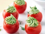fresh tomatoes filled with greenery and cream cheese are a refreshing fall appetizer to go for