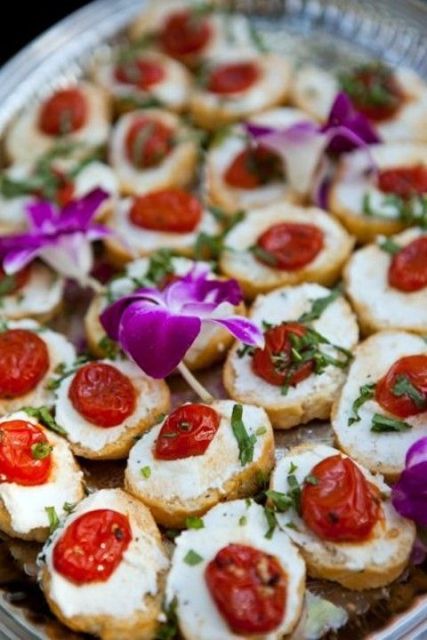 mini sandwiches with cheese, sun dried tomatoes and fresh greenery wil remind the guests that it's harvest time