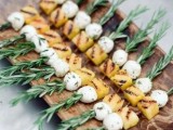 a modern take on classic Caprese skewers – mozzarella with melon and greenery