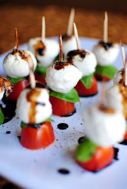 Caprese skewers of tomatoes, mozzarella and basil plus balsamic are a timeless appetizer idea for each wedding