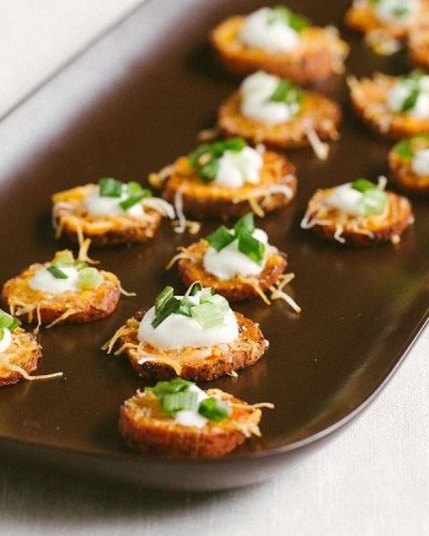 grilled sweet potatoes with cream cheese and greenery are hearty appetizers for the fall