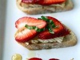 crostini with cream cheese, strawberries and fresh greenery are a delicious and light appetizer idea