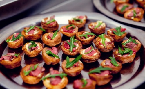 mini tarts with cream cheese, smoked salmon and greenery on top are delicious and not too hearty