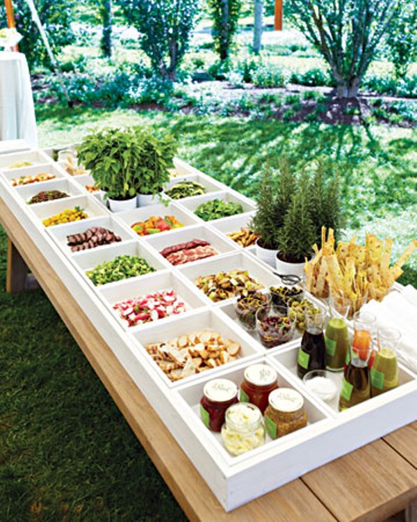 a wedding fresh salad bar with various types of fresh veggies with various sauces and dips and Fresh fries