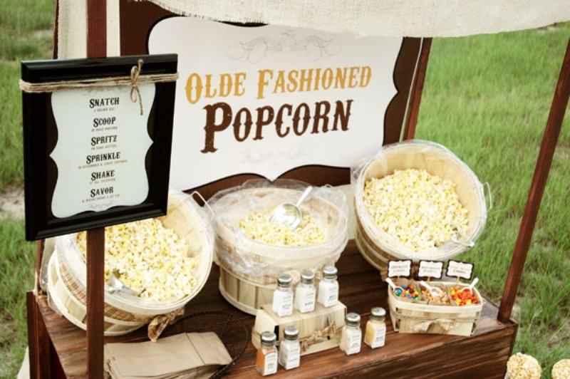A simple and retro popcorn bar styled with various toppings is a cool idea for any wedding, not only a retro one