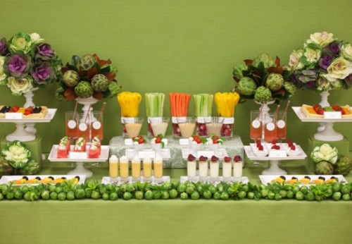 a fresh veggies and juice bar, with fruits tarts, veggie and flower arrangements and edible decor