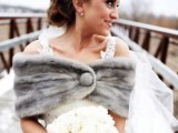 a grey faux fur coverup with a button is a great piece to pair it with a sleeveless or strapless wedding dress