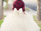 a red and black plaid shirt is a stylish and relaxed coverup for a fall or winter bride