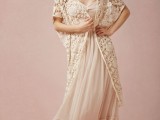 a long sleeveless lace coverup in a creamy shade is a boho touch to your fall bridal look