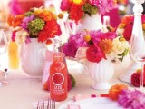 a super bold wedding tablescape with fuchsia, red and yellow blooms – floral arrangements, lemonade and colorful linens