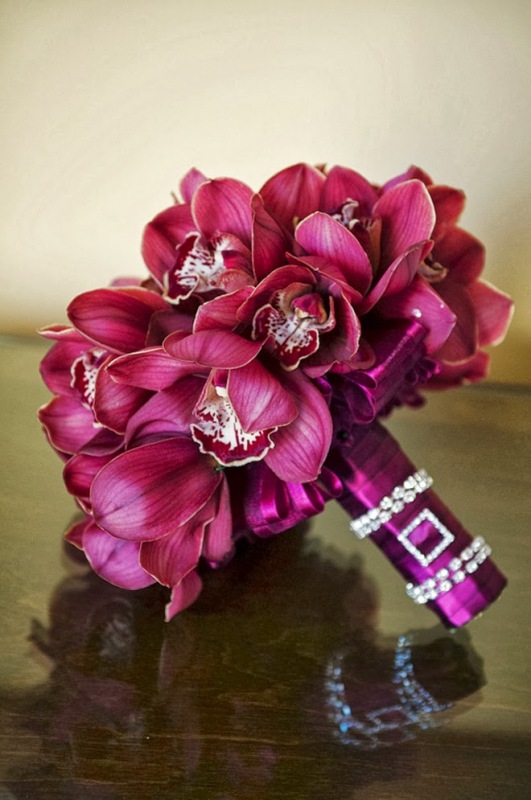A bold ribbon wrap with rhinestone accents perfectly fits the bold wedding bouquet itself adding a bit of glam