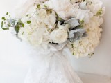 a white lace wrap will make your wedding bouquet really ethereal and very airy