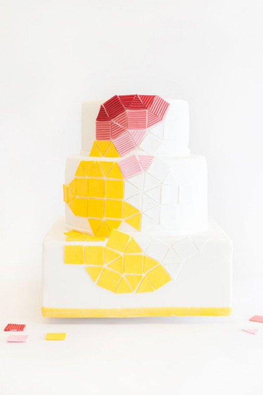 a white square wedding cake with bold color block geometric detailing is a statement idea for a modern colorful wedding