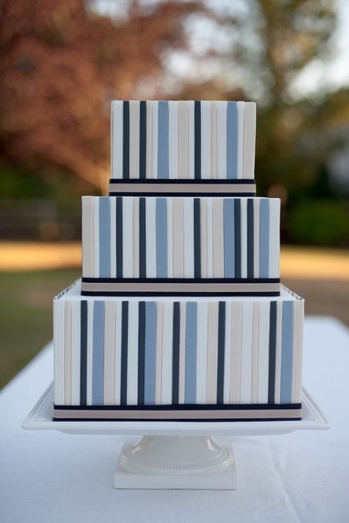 a square wedding cake with bold striped tiers and black edges is a bold and statement-like idea for a modern wedding
