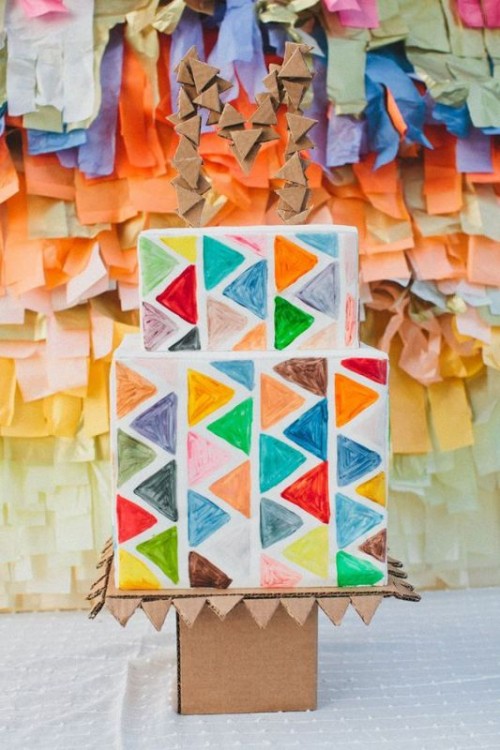 a bright square wedding cake with colorful triangles is a bold and cool idea for a mid-century modern wedding