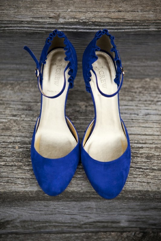 Navy shoes with ankle straps and a scallop edge for a bold 'something blue' touch in the bridal look