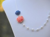 a chic pearl bridal or bridesmaid necklace with a coral and a navy bloom