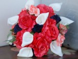 a bold wedding bouquet with white calla lilies, navy and coral pink blooms and touches of greenery