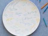 a large white ddish or your ring dish can become a nice guest book with colorful signatures and wishes