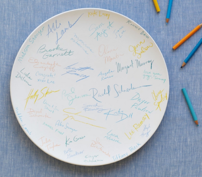 A large white ddish or your ring dish can become a nice guest book with colorful signatures and wishes
