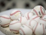 if you love baseball or play it, offer your guests baseball balls to sign them up