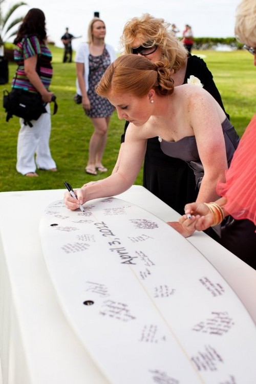 a surf as a guest book is a cool idea for a surfers' or beach wedding, or if you two are into this sport