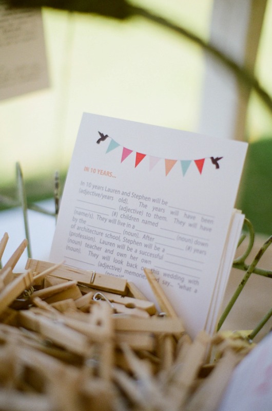 Wooden clothespins as a guest book to sign your wishes right on them is a great idea