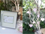 a whitewashed tree with pink hearts that are to be signed by the guests is a creative and fun idea