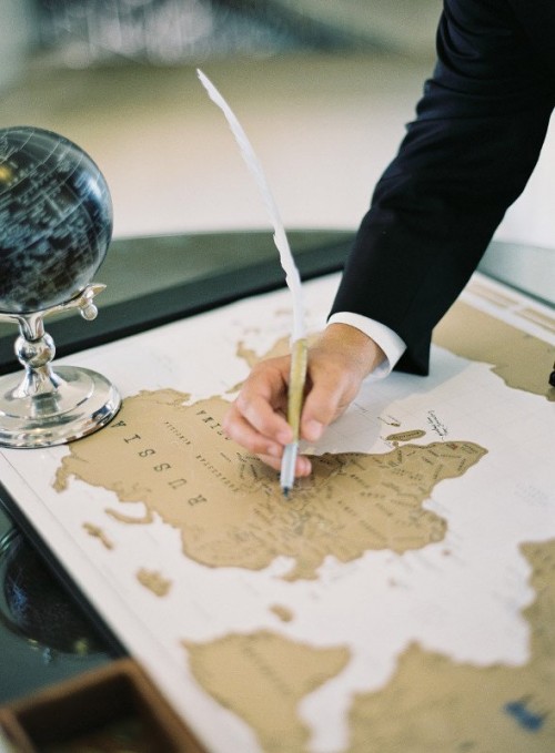 a map of the world as a wedding guest book can be signed by the guests - show off the parts of the wolrd where you've been