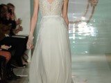 an A-line wedding dress with a lace bodice and short sleeves, a plain skirt with a train looks modern and fresh