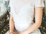 a lace A-line wedding dress with an embellished corset, neckline and short sleeves looks royal-like