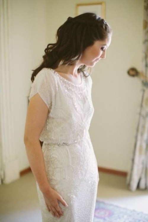 an embellished and embroidered fitting wedding dress with short sleeves, an illusion neckline looks refined and really chic