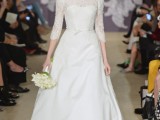 an off the shoulder a-line wedding dress with a lace bodice and short sleeves plus a plain full skirt with a train