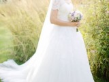 a lace wedding ballgown with short sleeves, a V-neckline and a train is a gorgeous idea for a formal wedding