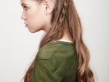 a folksy half updo with a messy volume on top, a braided halo and braids down plus waves down feels Viking-like