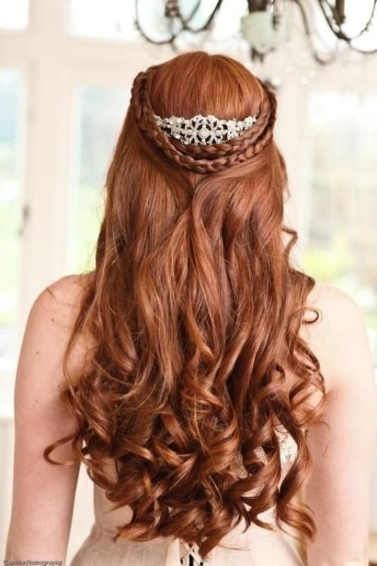 A jaw dropping half updo with a double braided halo, twists and waves down, an embellished hairpiece for a Queen like look