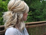 a messy half updo for medium length hair, with a messy volume on to and waves down is another classic option to rock