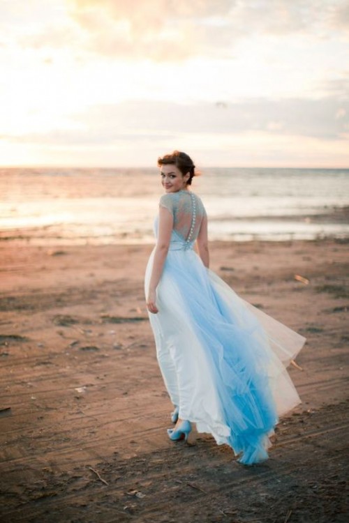 a blue lace wedding dress with a blue trail and bold blue shoes is a cool and chic idea for your 'something blue'