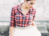 a plaid shirt, a tutu skirt with an embellished sash, a statement chain necklace for a rustic bridal look
