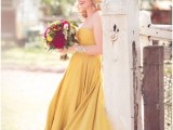 a sunshine yellow strapless A-line wedding dress paired with statement accessories is very bold
