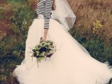 a striped top, a full tutu skirt with a train and a veil for an out of the box bridal look