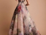 a strapless dark floral wedding ballgown with a bustier bodice and a train for a strong wow factor
