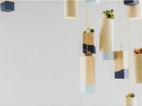 hanging color block vases with light and midnight blue touches and small succulents for venue decor