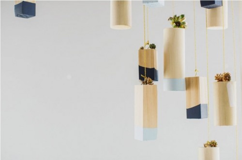 hanging color block vases with light and midnight blue touches and small succulents for venue decor