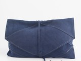 a cool midnight blue leather clutch will hold everything a bride needs on her big day