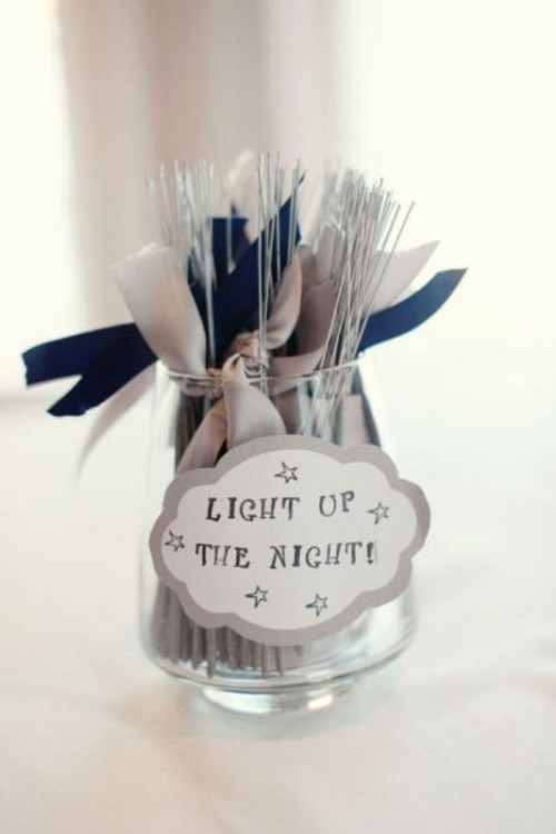 a jar with sparklers and white and blue ties for your wedding exit