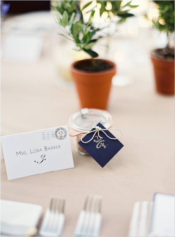 a wedding favor with a personalized midnight blue card attached